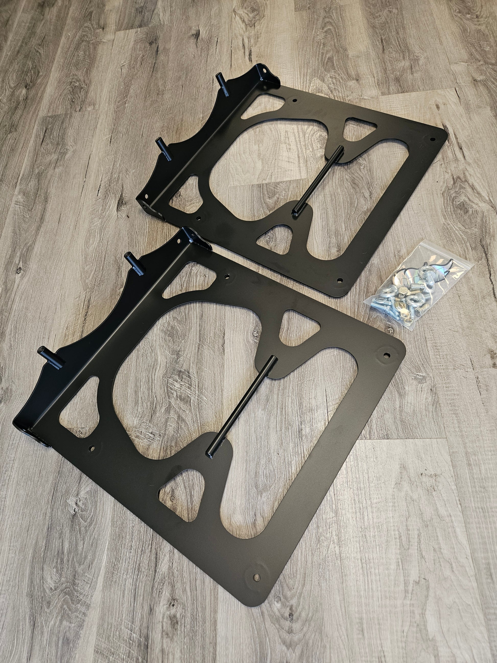 Harness bar underseat brackets for Mclaren 720S Coupe, matte black finish, includes hardware for 6pt racing harness installation.
