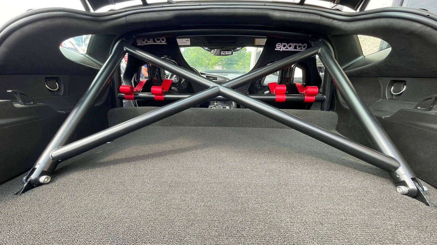 WPM C7 Corvette Clubsport half cage roll bar with red racing seats, ideal for track day performance.