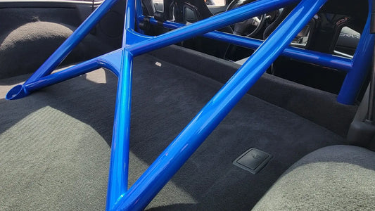 WPM C6 Corvette Clubsport half cage roll bar in blue, designed for minimal interior intrusion, ideal for weekend racers.