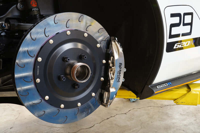 AP Racing 9669 front brake kit on McLaren 620R showcasing ENP caliper and rotor design.