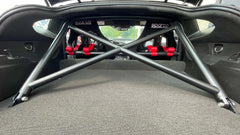 WPM C7 Corvette Clubsport half cage roll bar with red racing seats, ideal for track day performance.