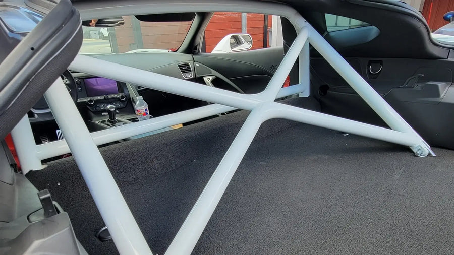 WPM C7 Corvette Clubsport Half Cage roll bar installed in the rear of a Corvette, featuring sturdy Docol R8 construction.