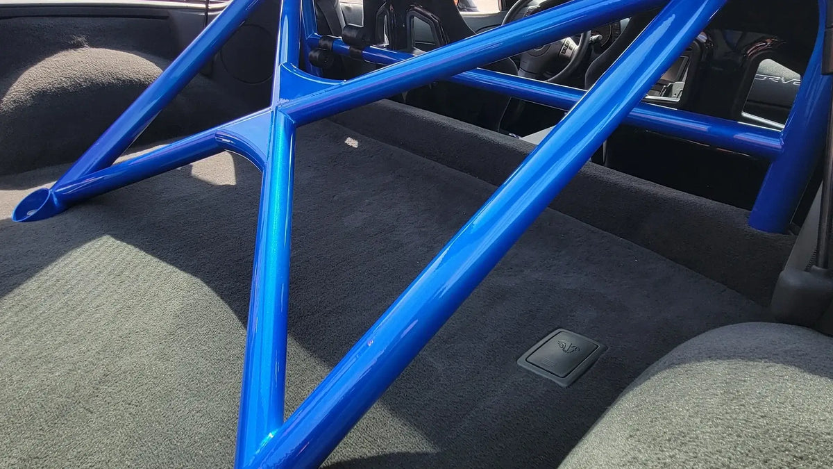 WPM C6 Corvette Clubsport half cage roll bar in blue, designed for minimal interior intrusion, ideal for weekend racers.