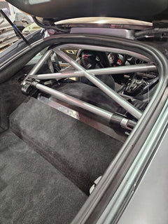 WPM bolt-in roll bar installed in a Mercedes AMG GT interior, offering safety and style for performance builds.