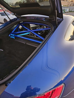 Blue AMG GT featuring a bolt-in roll bar for enhanced safety and performance.