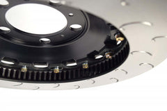 Close-up of AP Racing 2-piece J Hook competition disc with detailed metal design and airflow slots.