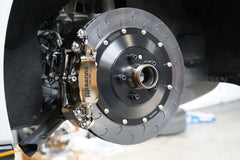 AP Racing 9449 380mm ENP rear brake kit installed on McLaren, featuring durable caliper and rotor.